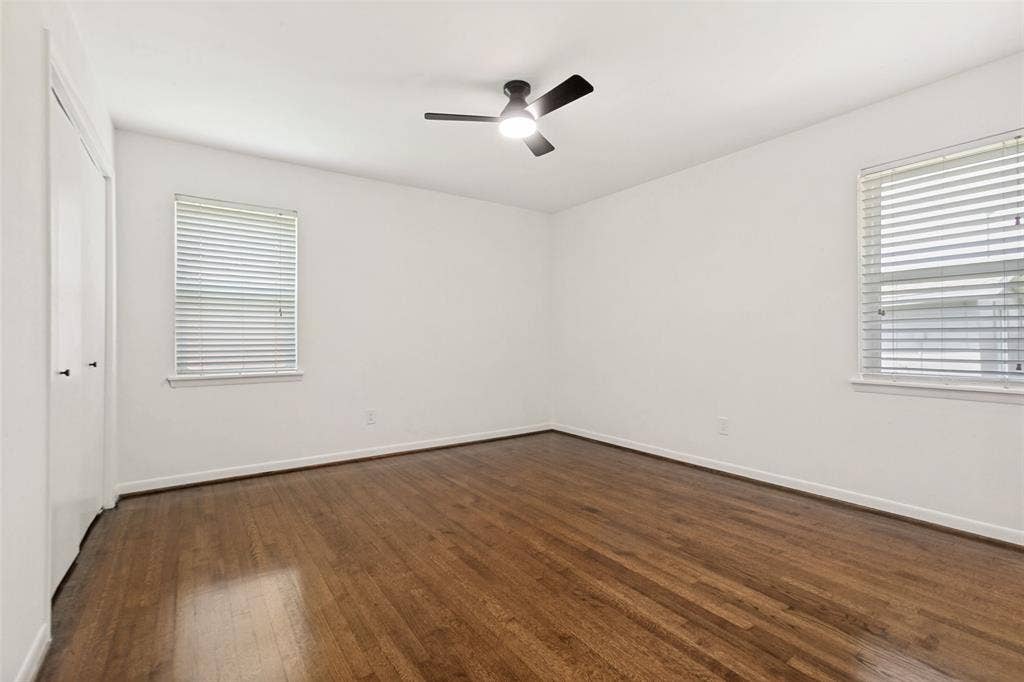 2413 Patricia Lane, Garland, TX 75041 Primary bedroom with ceiling fan, closet and ensuite bathroom