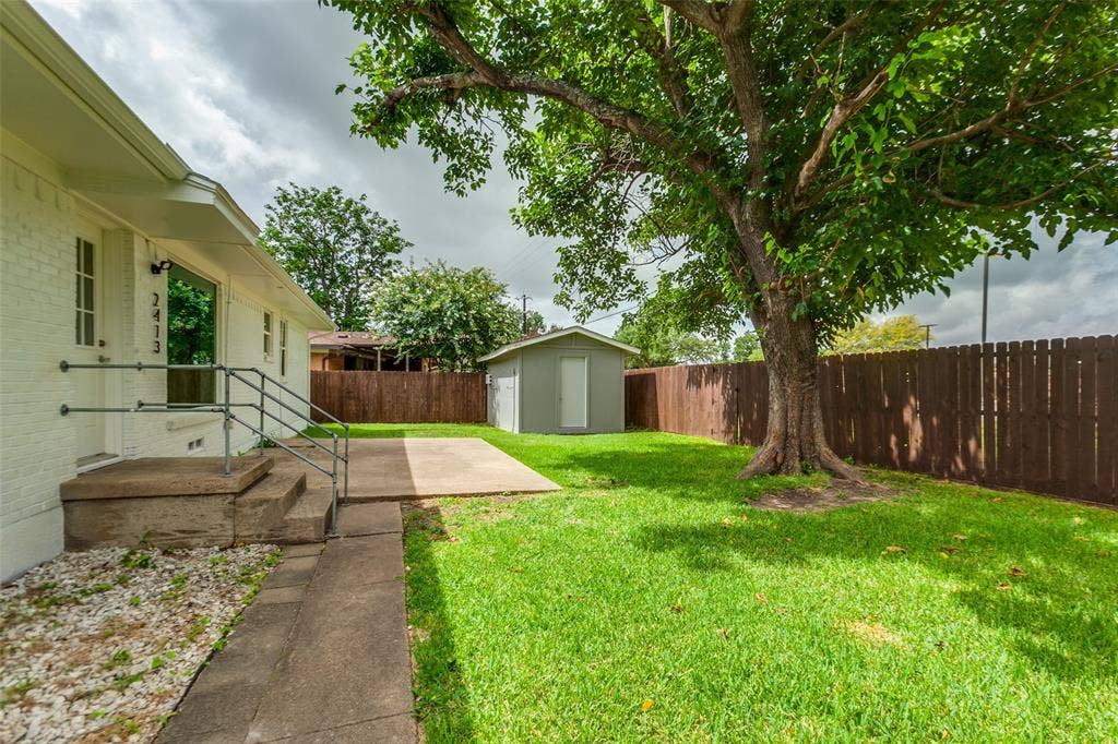2413 Patricia Lane, Garland, TX 75041 Backyard with shed for extra storage. Shed has electricity and portable a/c unit