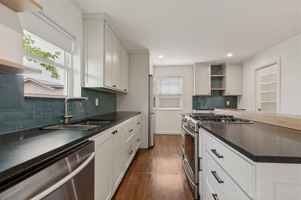 2413 Patricia Lane, Garland, TX 75041 The kitchen is equipped with a gas range, and the island adds plenty of counter space