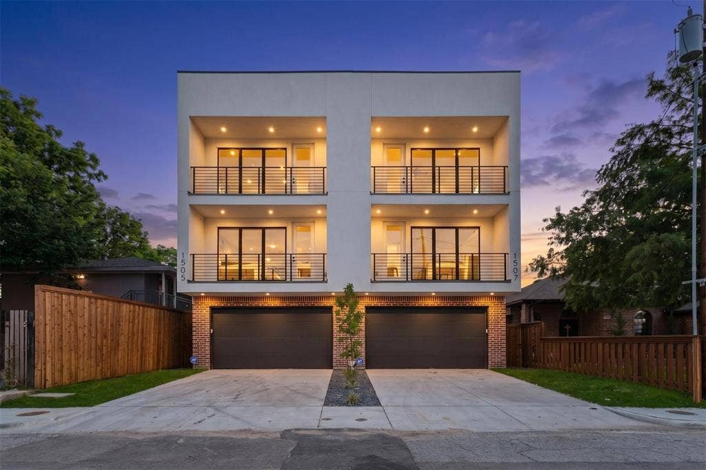 Modern multi-level facade featuring two units, each with two private balconies with metal railings