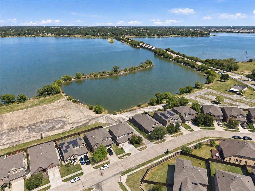 2025 Lake Front Trail, Garland, TX 75043 Aerial perspective showcasing a residential community with direct water access