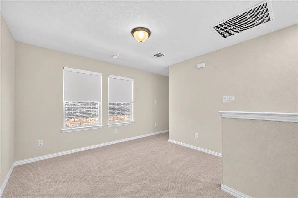 2025 Lake Front Trail, Garland, TX 75043 Neutral-toned walls complement plush carpet flooring