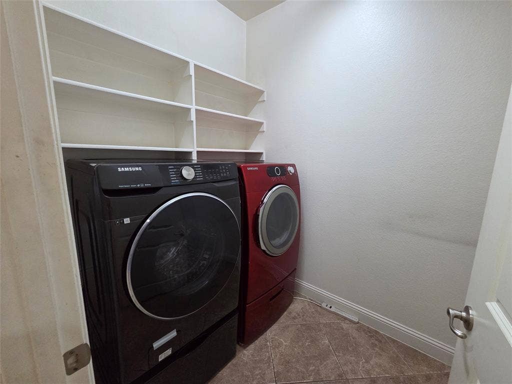 146 Rolling Fork Bend, Irving, TX 75039 Built-in shelving for storage, neutral wall paint, and tile flooring