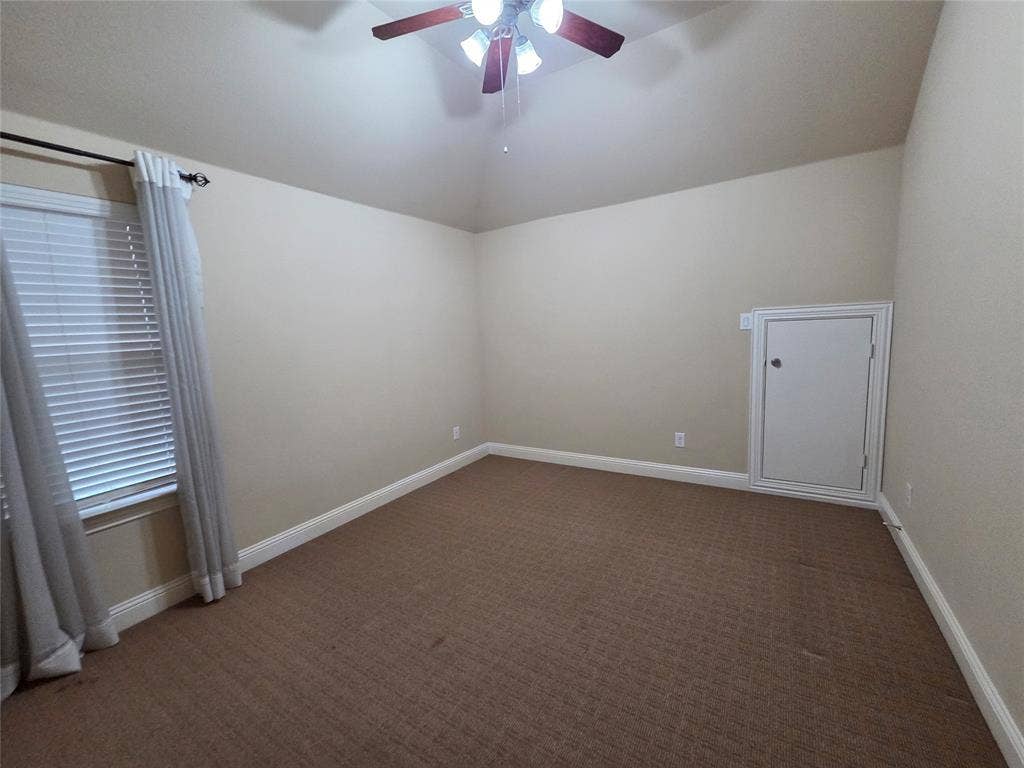 146 Rolling Fork Bend, Irving, TX 75039 Vaulted ceiling with a ceiling fan light fixture, window with blinds, wall-to-wall carpeting, and a built-in wall access panel