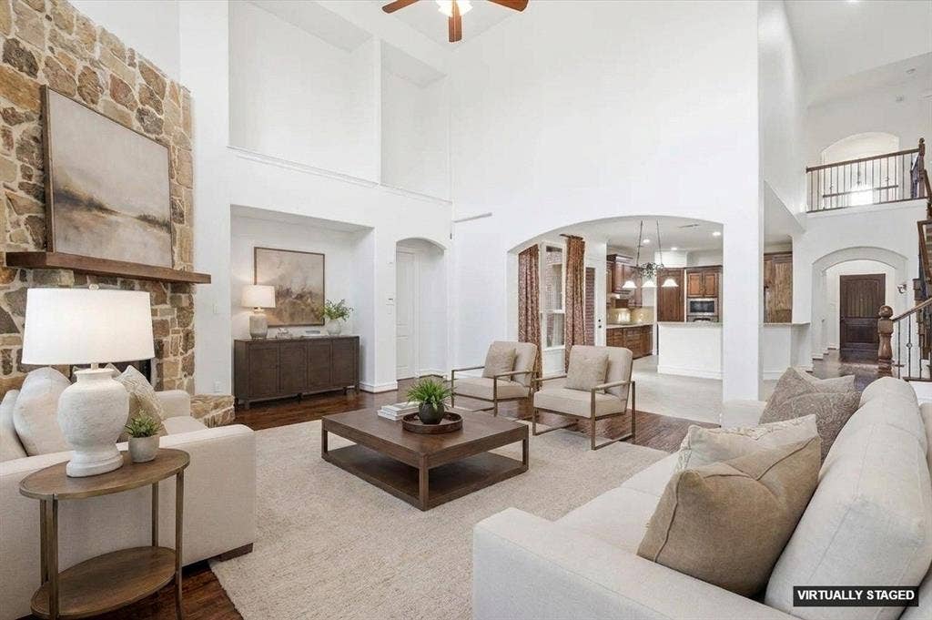 420 Silverado Trail, Keller, TX 76248 Great room with high ceilings, stone fireplace, wood-finish flooring, and arched doorways