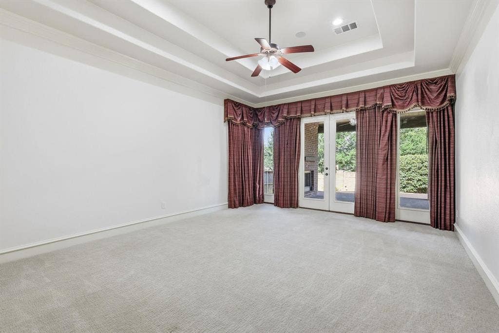 420 Silverado Trail, Keller, TX 76248 Tray ceiling with crown molding, ceiling fan, recessed lighting, and double glass doors