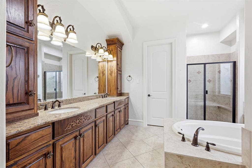 420 Silverado Trail, Keller, TX 76248 Dual sink vanity with wood-finish cabinetry and granite-style countertop