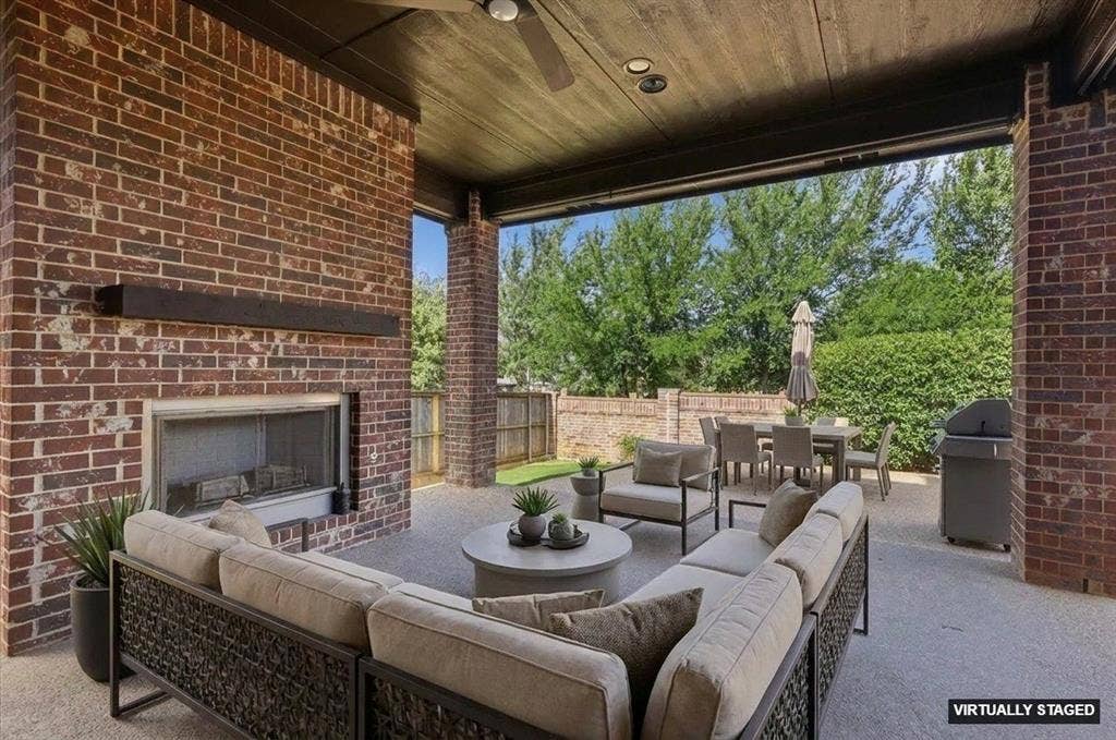 420 Silverado Trail, Keller, TX 76248 Covered patio featuring a brick fireplace with a mantle, ceiling fan, and recessed lighting