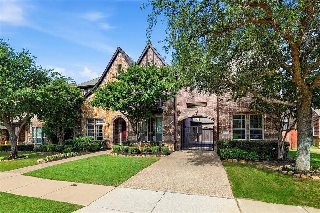 420 Silverado Trail, Keller, TX 76248 Stone and brick exterior with a peaked roofline