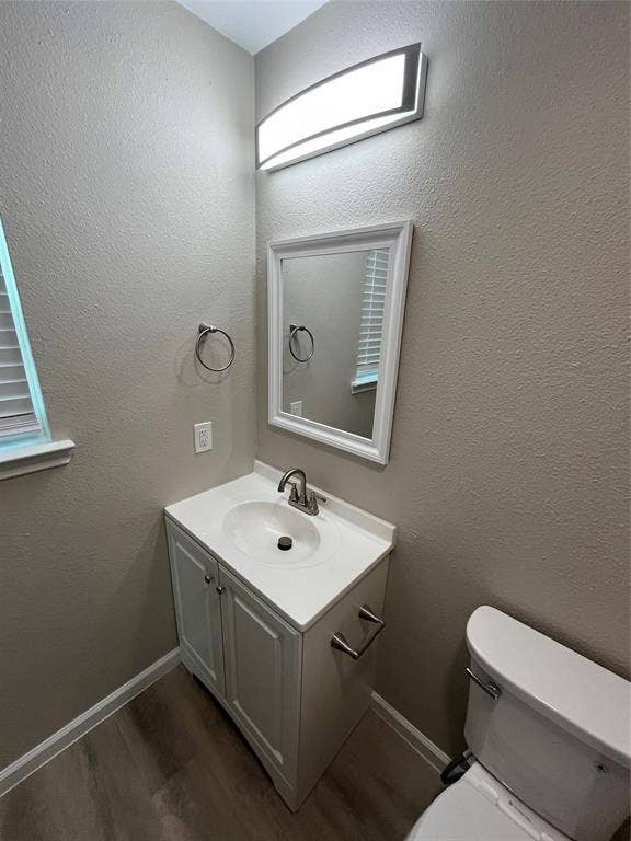 9615 Oak Gate Lane, Dallas, TX 75217 Contemporary vanity with integrated sink, brushed nickel faucet, and framed mirror