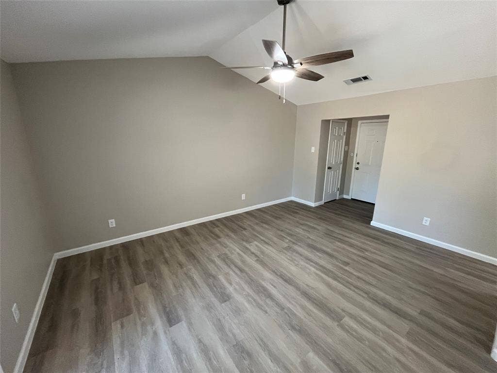 9615 Oak Gate Lane, Dallas, TX 75217 Vaulted ceiling with a ceiling fan