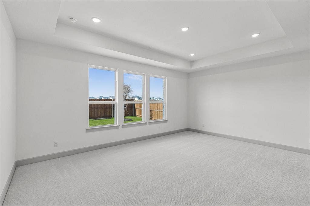 1825 Vetiver Glow Drive, Celina, TX 75009 The peaceful owner's suite is located at the back of the home for additional privacy.