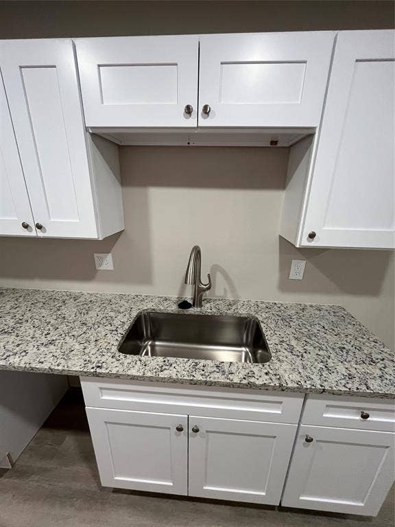 1831 Moonbeam Lane, Carrollton, TX 75006 Stainless steel sink, granite-style countertop, white shaker cabinetry, and brushed nickel hardware