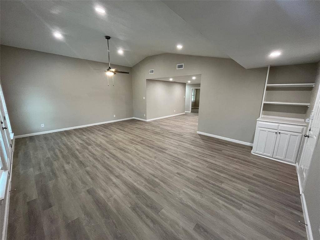 1831 Moonbeam Lane, Carrollton, TX 75006 Vaulted ceiling with recessed lighting and a ceiling fan