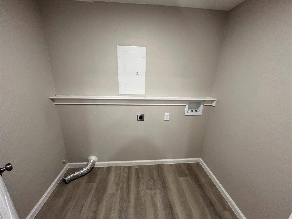 1831 Moonbeam Lane, Carrollton, TX 75006 Wood-finish flooring, white wall trim, and a utility shelf
