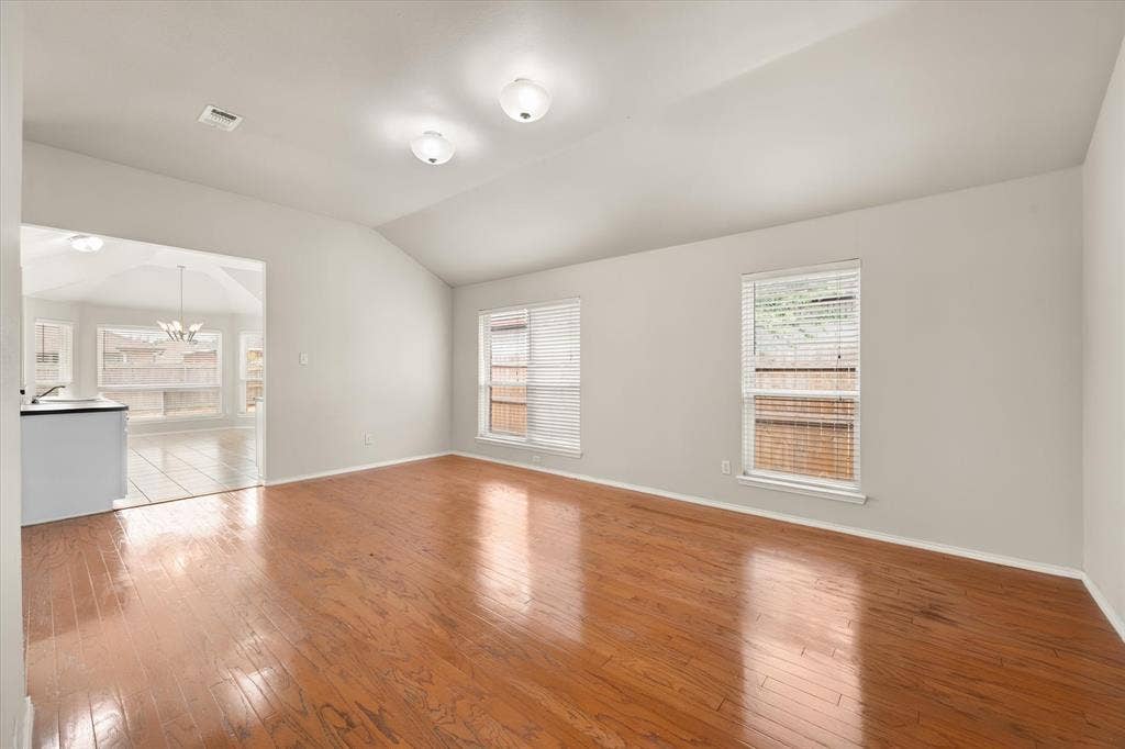 1017 Caleb Street, Burleson, TX 76028 This room can be used as dining room or extra living area. Wood floors