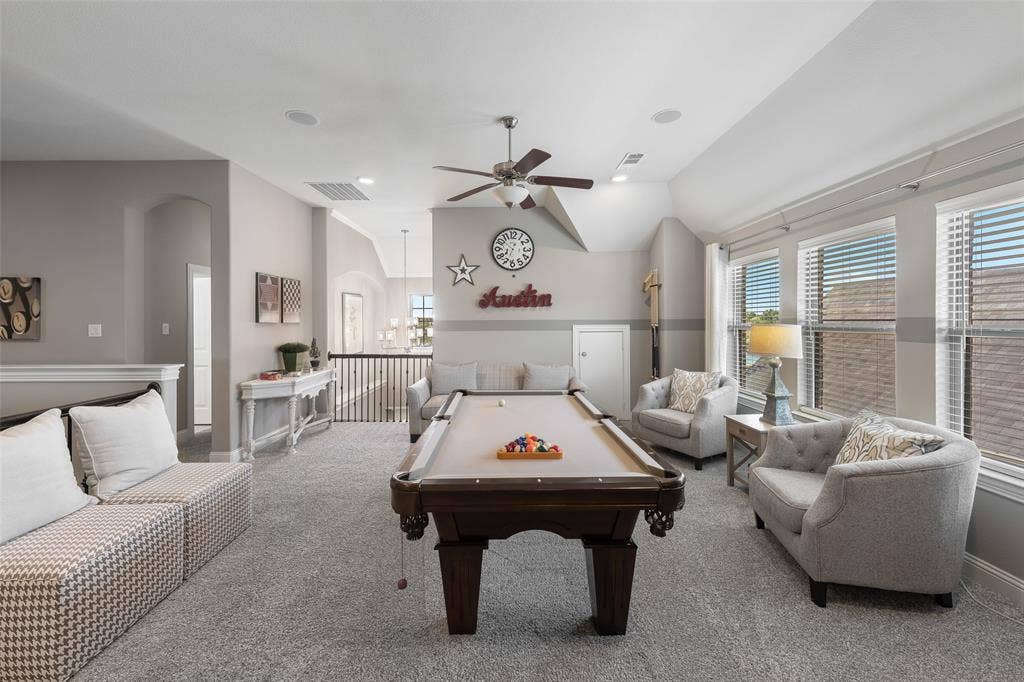 121 Lantana Lane, Wylie, TX 75098 Carpeted room with multiple windows, a ceiling fan, and a built-in architectural niche