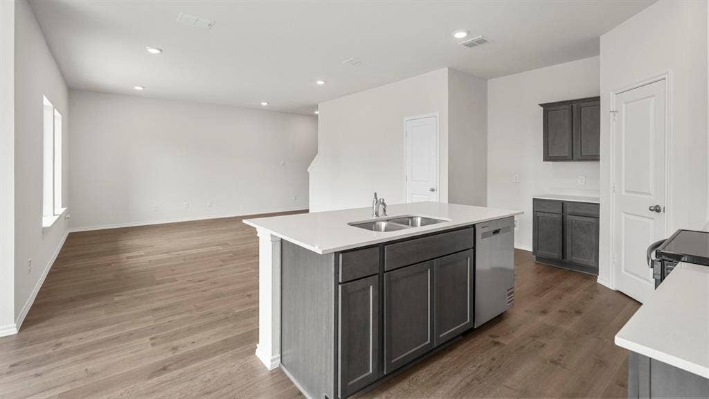 5610 Gannet Place, Crandall, TX 75114 Kitchen island with dual stainless steel sink and integrated dishwasher