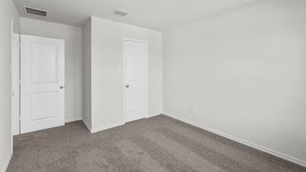 5610 Gannet Place, Crandall, TX 75114 Neutral-toned room featuring light gray walls, plush gray carpeting, and white baseboards