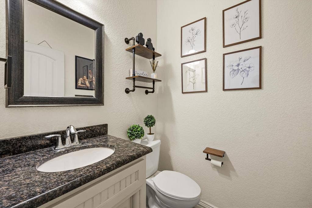 1004 W Apache Trail, Granbury, TX 76048 Half bath on first floor
