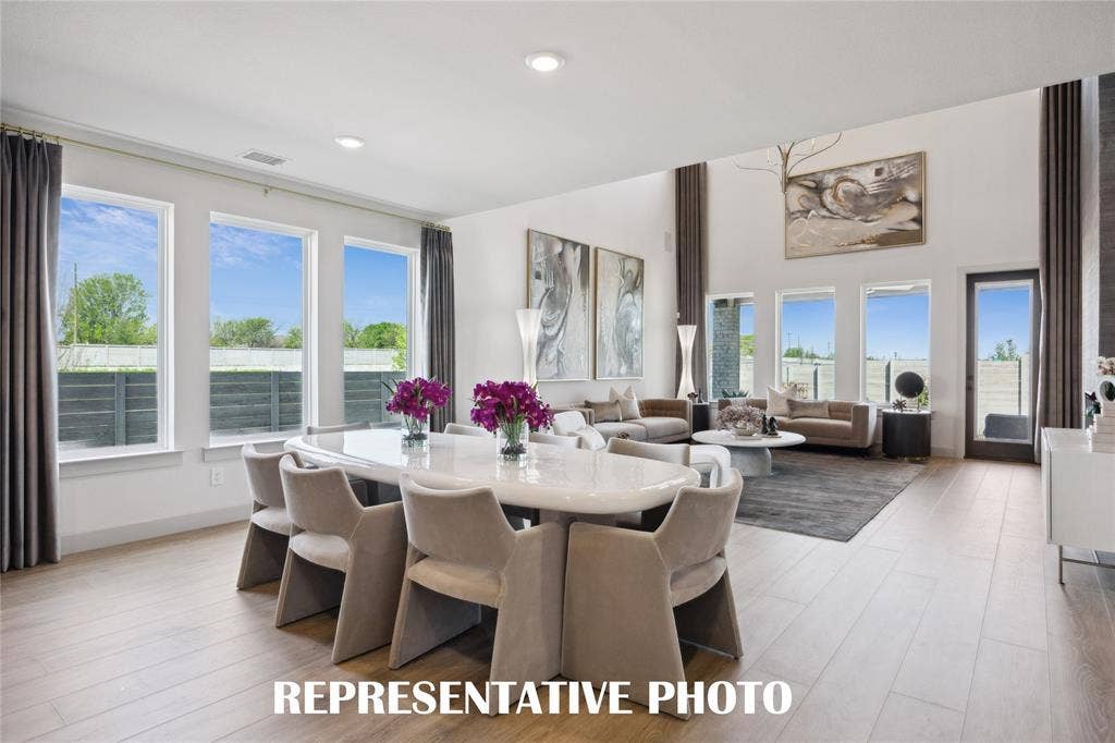 1801 Vetiver Glow Drive, Celina, TX 75009 Whether it's grand dinner parties or cozy family meals, this dining room does it all! REPRESENTATIVE PHOTO