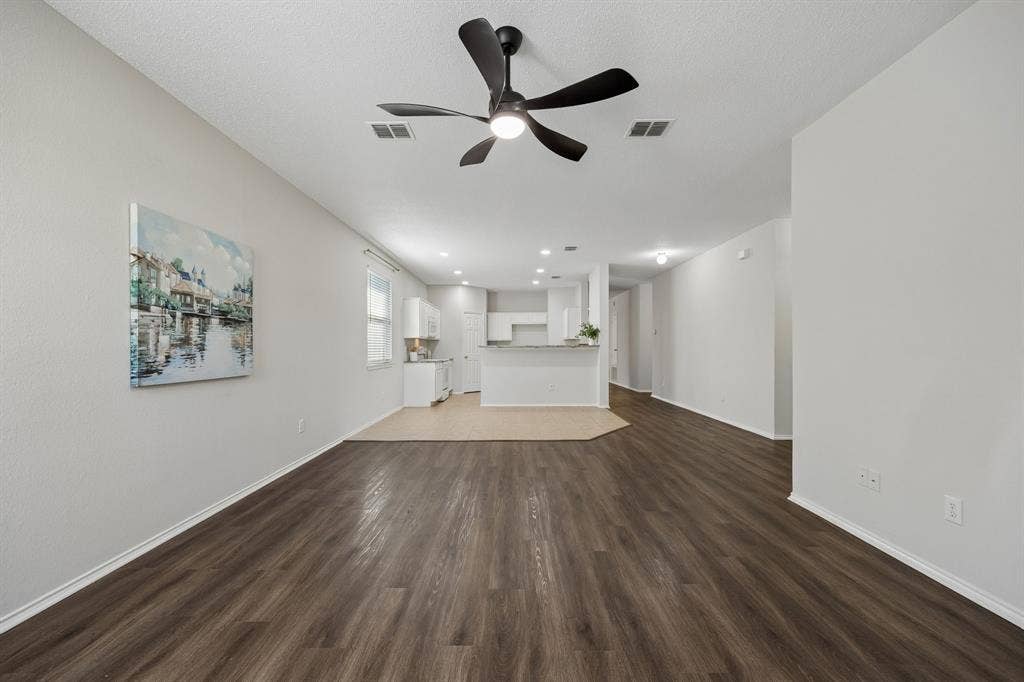 Open Living Designed to Stay Connected – From the family room, the open sightline extends into the kitchen and casual dining area, creating an easy flow for everyday living and entertaining while LVP flooring gives the main living space a cohesive finish.