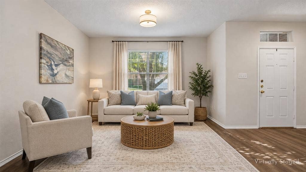A Front Living Space Filled with Natural Light – A large front window brightens this versatile living area, while the wide footprint gives you plenty of options for seating, entertaining, or creating a comfortable everyday retreat.