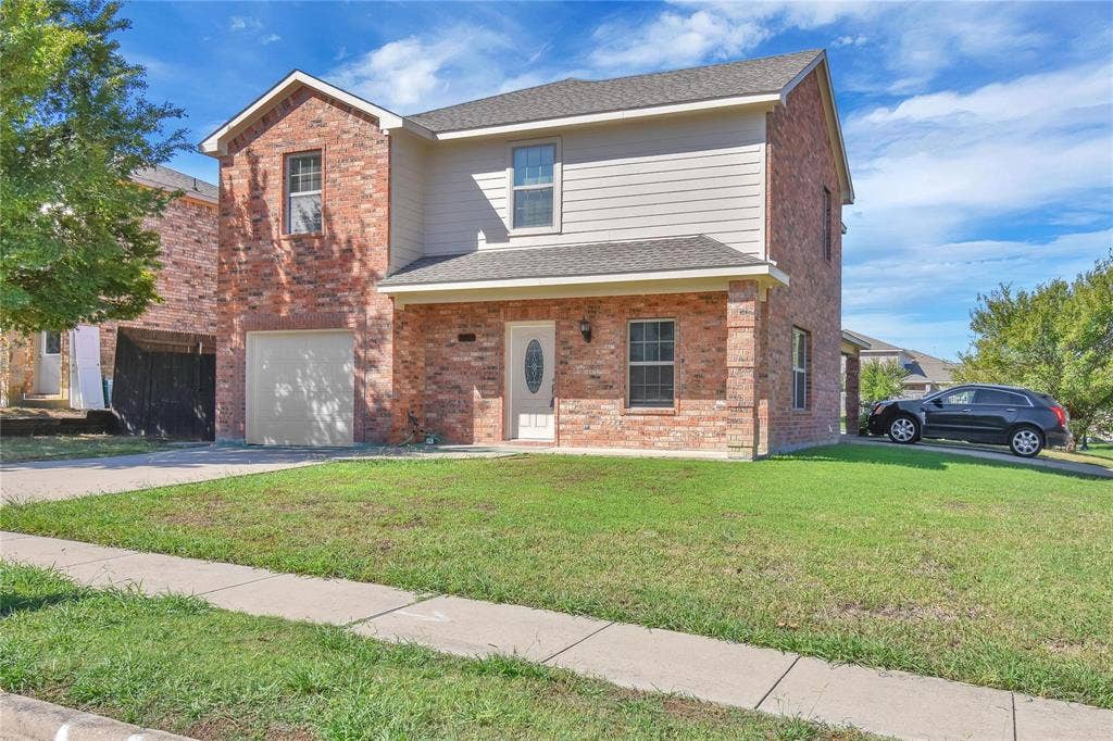 1102 Parkway Trail, Princeton, TX 75407 Brick and siding exterior with a covered entry, attached garage, and concrete driveway