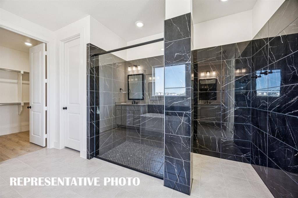 1809 Vetiver Glow Drive, Celina, TX 75009 You'll enjoy a spa like experience every day in the spacious owner's bath with walk in shower! REPRESENTATIVE PHOTO