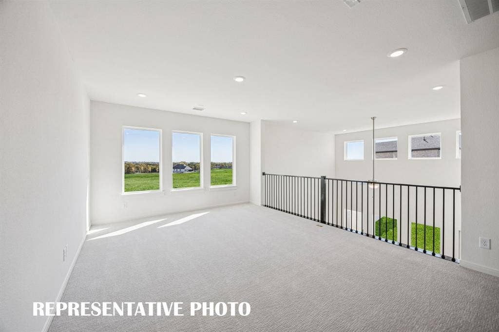 1809 Vetiver Glow Drive, Celina, TX 75009 Light, bright and open, this lovely game room is the perfect place to host those big game day parties! REPRESENTATIVE PHOTO