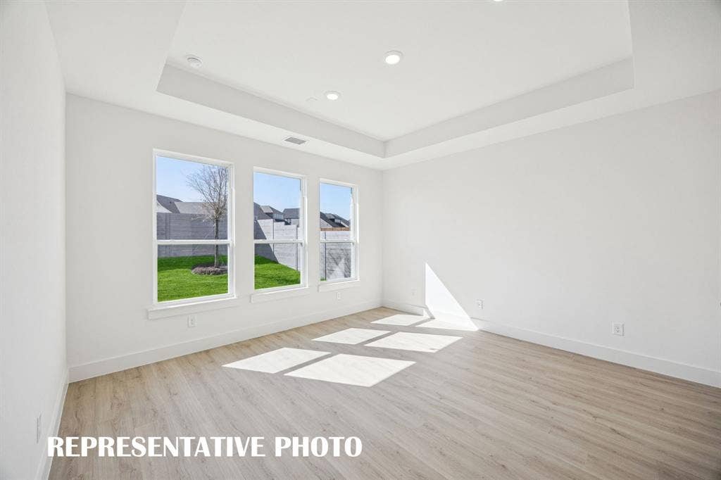 1809 Vetiver Glow Drive, Celina, TX 75009 Your dreamy new owner's suite is located at the rear of the home for additional privacy. REPRESENTATIVE PHOTO