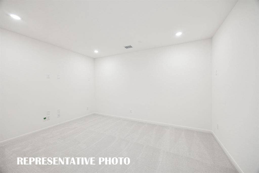 1809 Vetiver Glow Drive, Celina, TX 75009 This spacious media room with adjacent game room create the ultimate entertainment zone! REPRESENTATIVE PHOTO