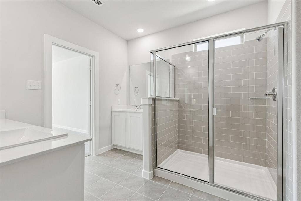 Primary Bathroom in the Winters home plan by Trophy Signature Homes – REPRESENTATIVE PHOTO