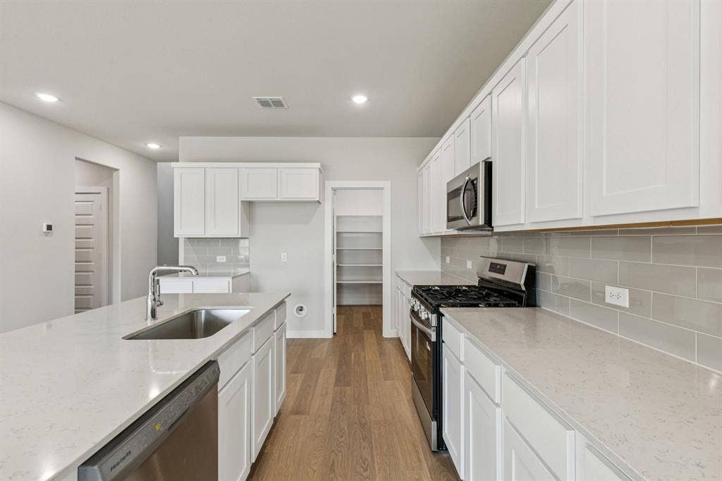 Kitchen in the Winters home plan by Trophy Signature Homes – REPRESENTATIVE PHOTO