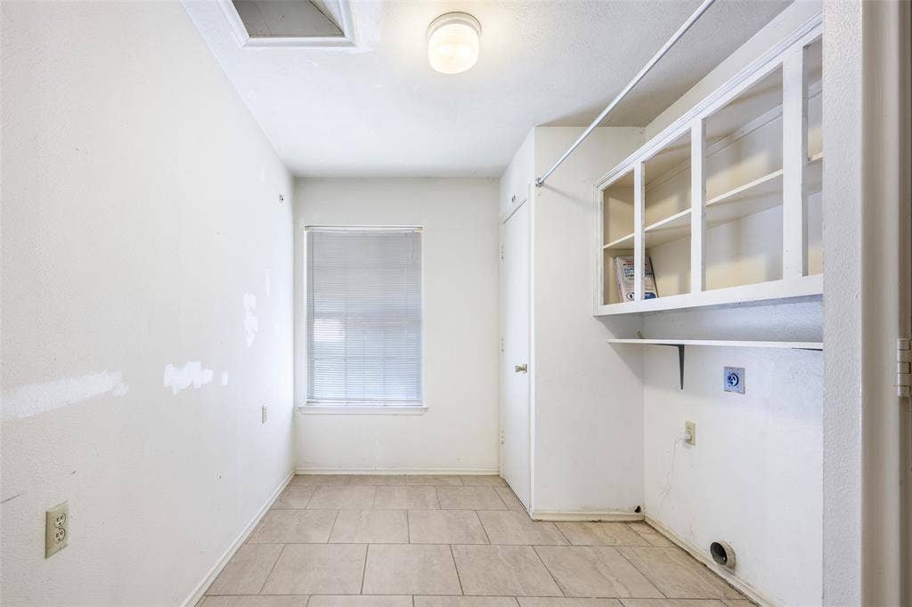635 Sherrill Boulevard, Duncanville, TX 75116 Ceramic tile flooring, built-in upper cabinetry, and a ceiling-mounted light fixture