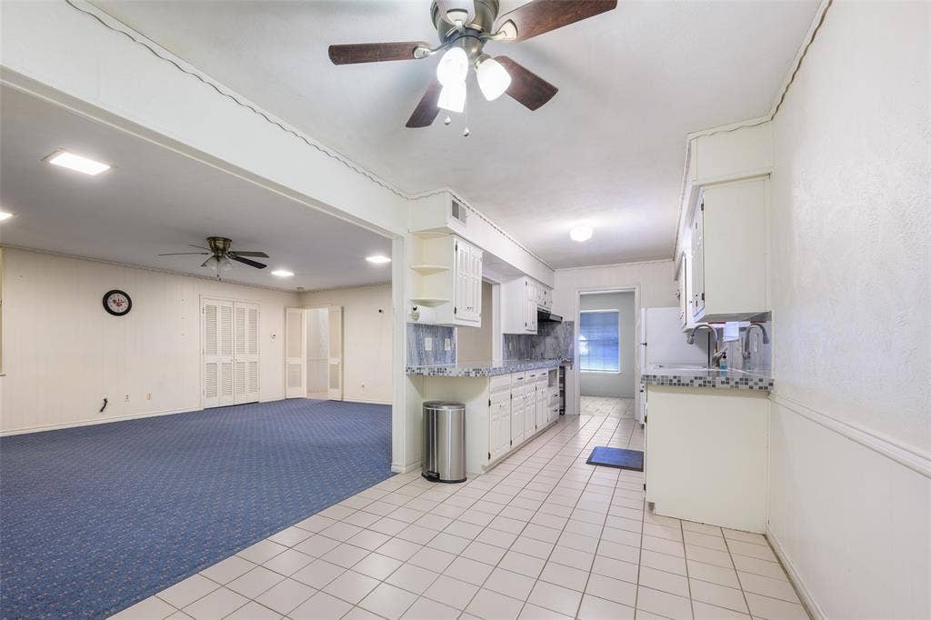 635 Sherrill Boulevard, Duncanville, TX 75116 Kitchen with white cabinetry, light-colored countertops, and tile flooring
