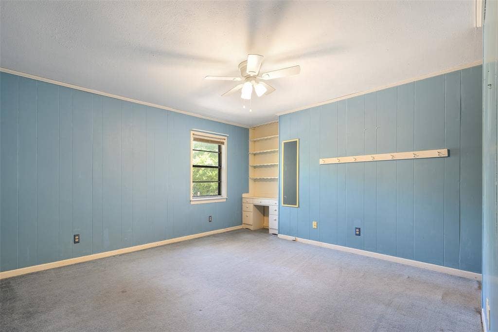 635 Sherrill Boulevard, Duncanville, TX 75116 Built-in shelving, integrated desk, and ceiling fan with lighting