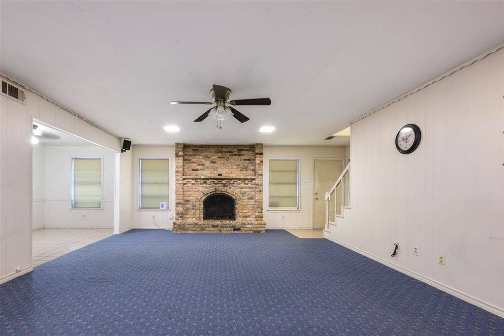 635 Sherrill Boulevard, Duncanville, TX 75116 Brick fireplace with an arched opening, recessed lighting, ceiling fan, and carpeted flooring