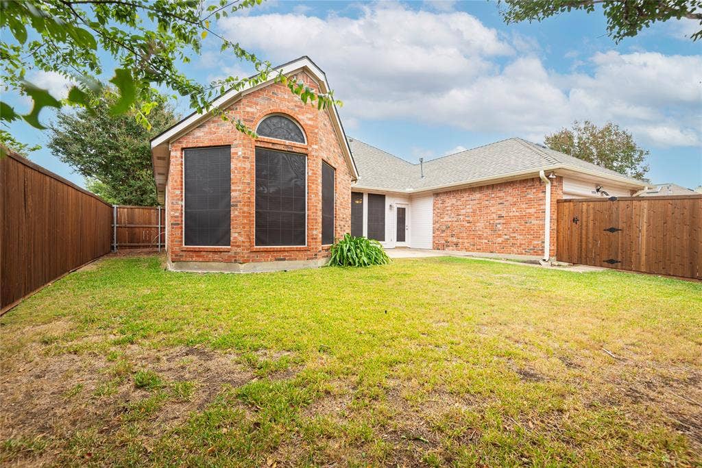 7829 Case Drive, Plano, TX 75025 Rear view of house featuring a yard and a patio