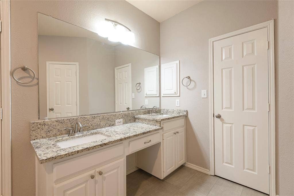 7829 Case Drive, Plano, TX 75025 Bathroom featuring tile patterned floors and vanity