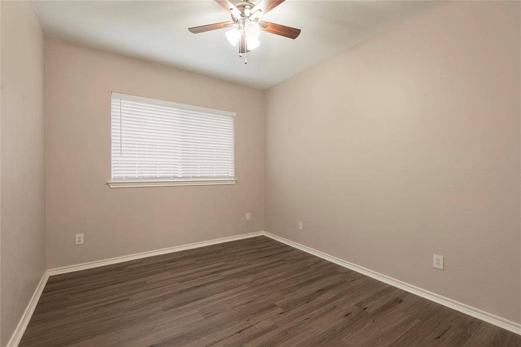 7829 Case Drive, Plano, TX 75025 Spare room with ceiling fan and dark hardwood / wood-style flooring