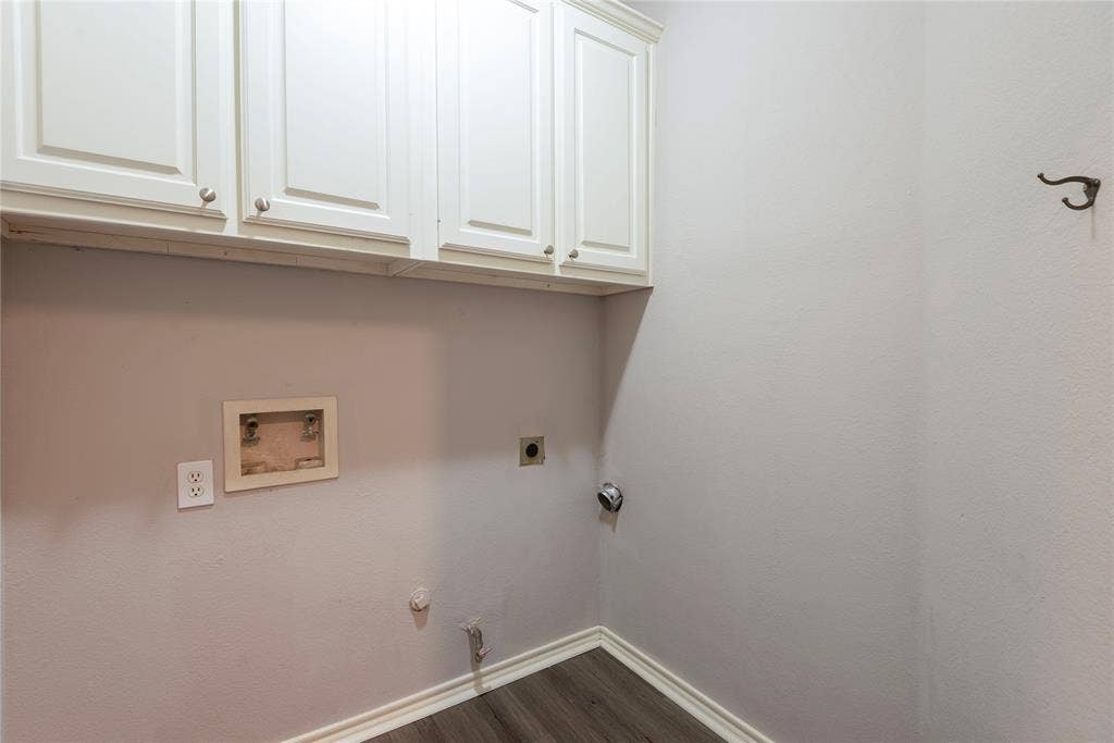 7829 Case Drive, Plano, TX 75025 Clothes washing area with electric dryer hookup, cabinets, gas dryer hookup, dark wood-type flooring, and hookup for a washing machine