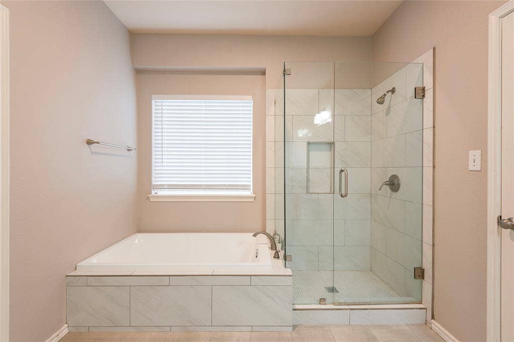 7829 Case Drive, Plano, TX 75025 Bathroom featuring tile patterned floors and shower with separate bathtub
