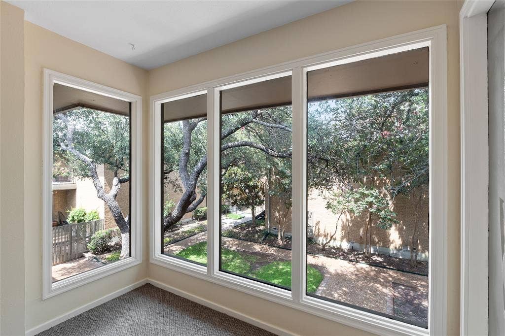 Detailed view of carpet flooring and baseboards