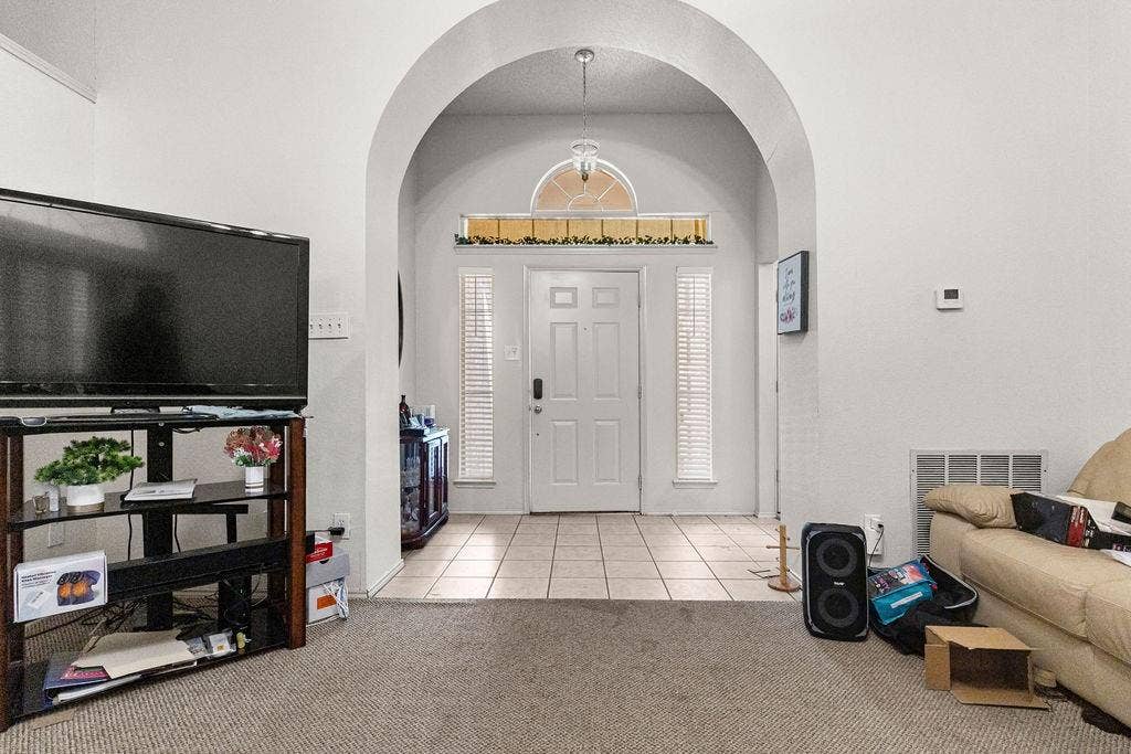 926 Wintercrest Court, Arlington, TX 76017 Archway entry with a front door featuring side-light windows and an arched transom