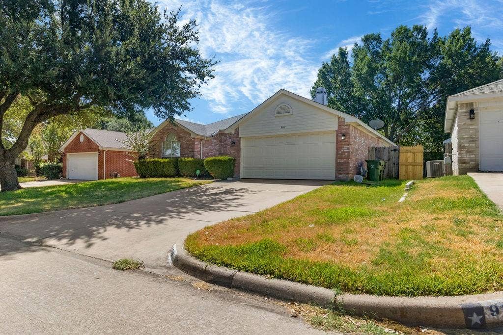 926 Wintercrest Court, Arlington, TX 76017 Brick exterior with a two-car garage, established front landscaping, an additional detached garage, and a concrete driveway