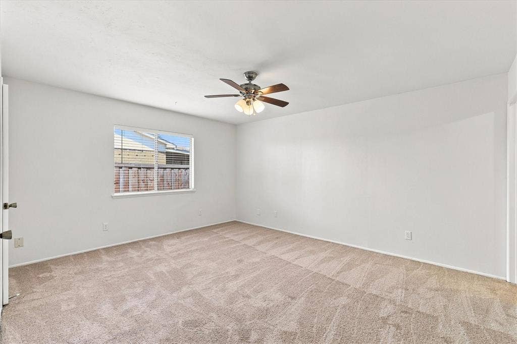 411 Clear Creek Lane, Coppell, TX 75019 Spacious primary suite with ceiling fan, ensuite bathroom, and two walk-in closets