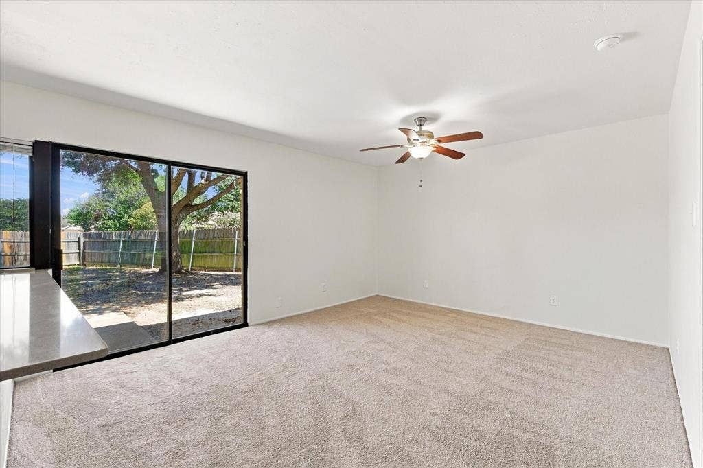 411 Clear Creek Lane, Coppell, TX 75019 Den opens to backyard