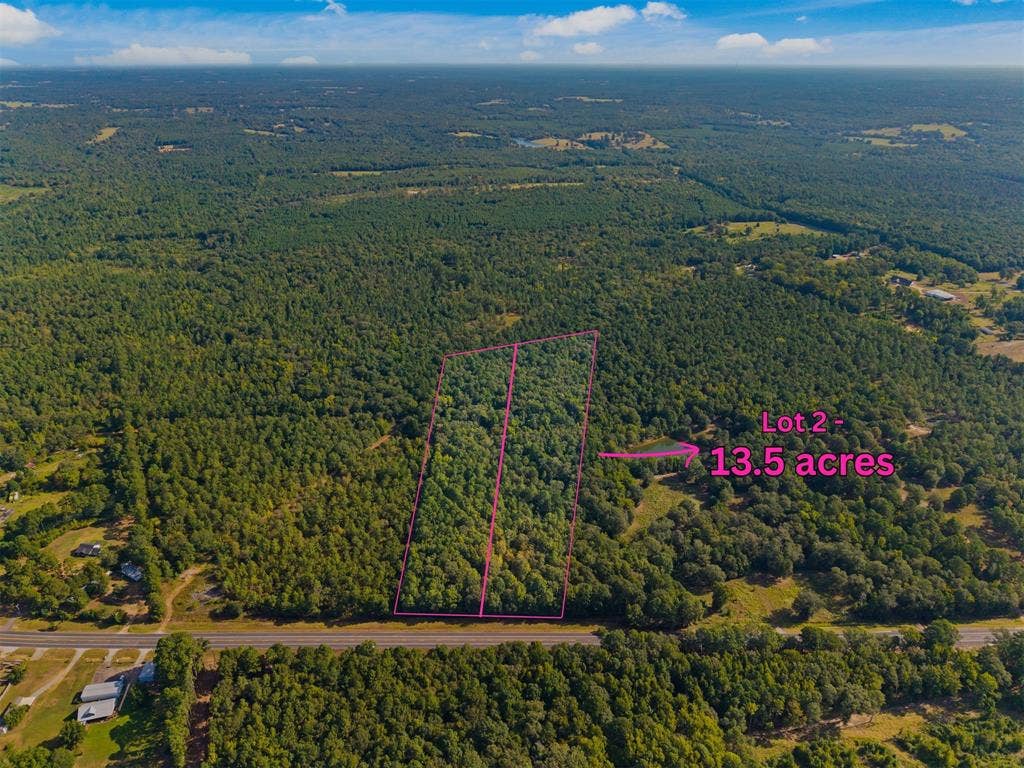 23791 State Highway 64 E, Troup, TX 75789 Expansive 13.5-acre lot featuring dense tree coverage and direct road frontage