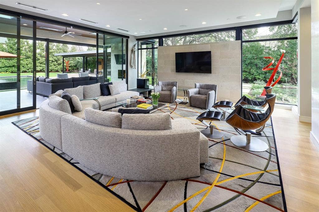 4745 Crooked Lane, Dallas, TX 75229 Family room with sliding doors to covered outdoor loggia